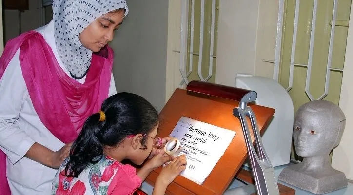 Low vision specialist measuring patient's field of vision